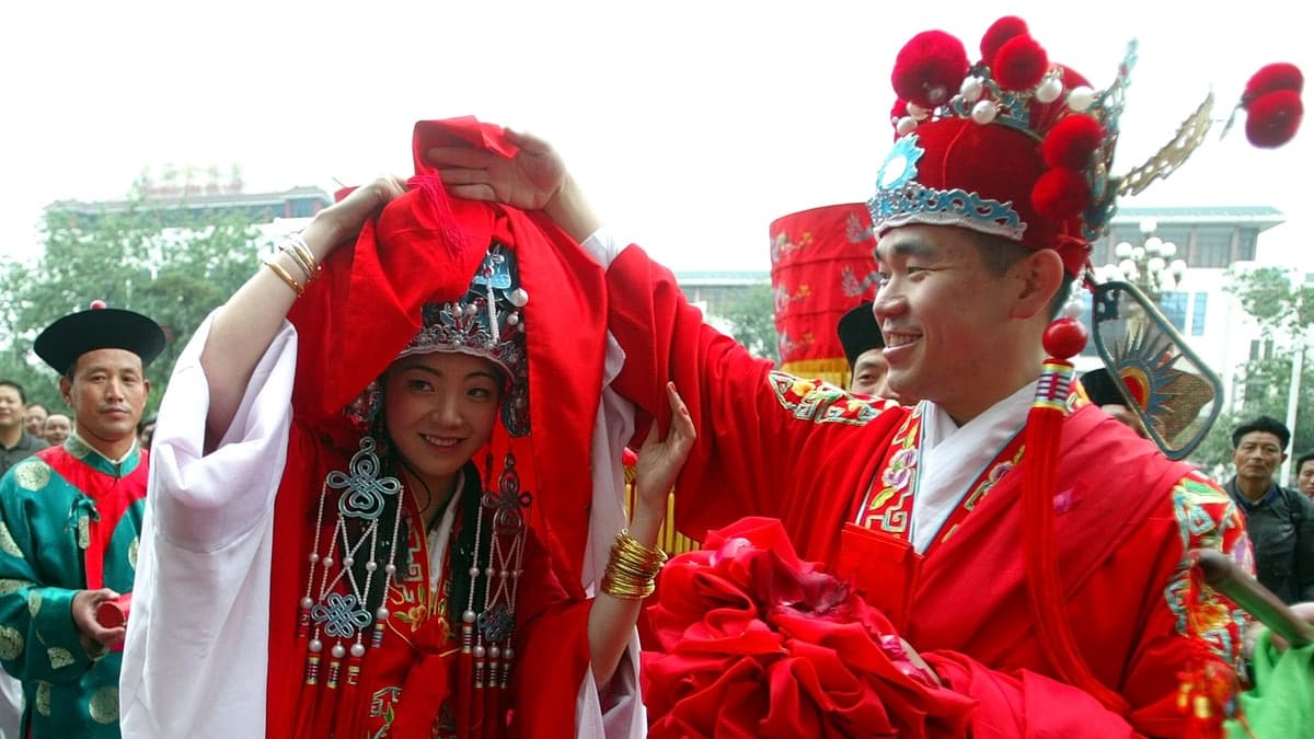 China's low birth rate being hit by sky rocketing costs associated with weddings