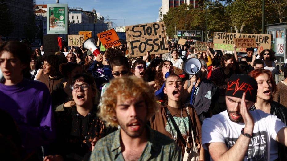 Radical climate protesters in Portugal storm building, urge economy minister to resign